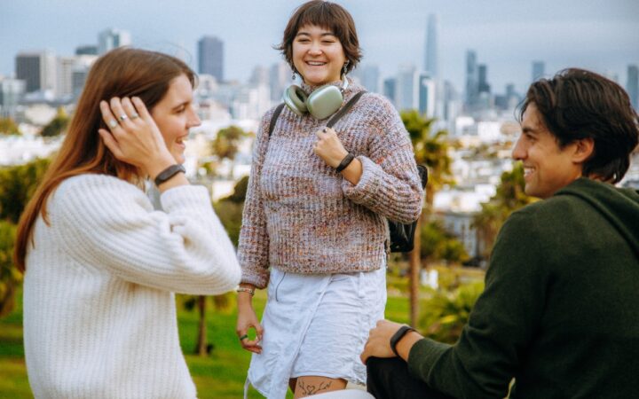 People wearing earlier Bee AI wristbands outdoors in an Amazon press photograph