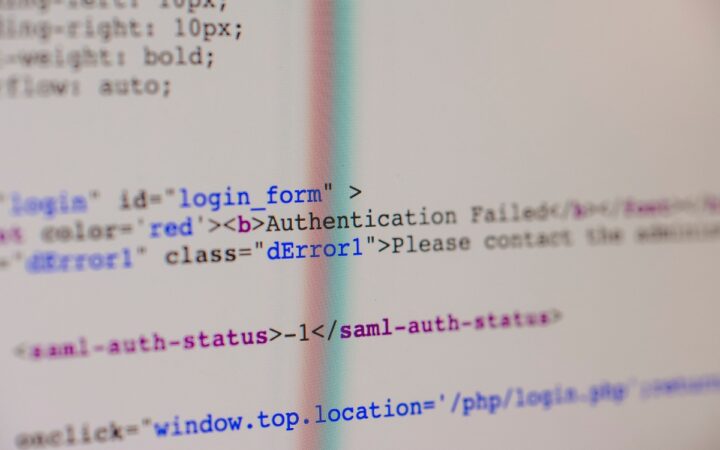 Close-up of web source code showing a login form and an authentication error